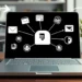 Laptop screen shows interconnected email, spreadsheet, CRM icons with arrows illustrating data flow.